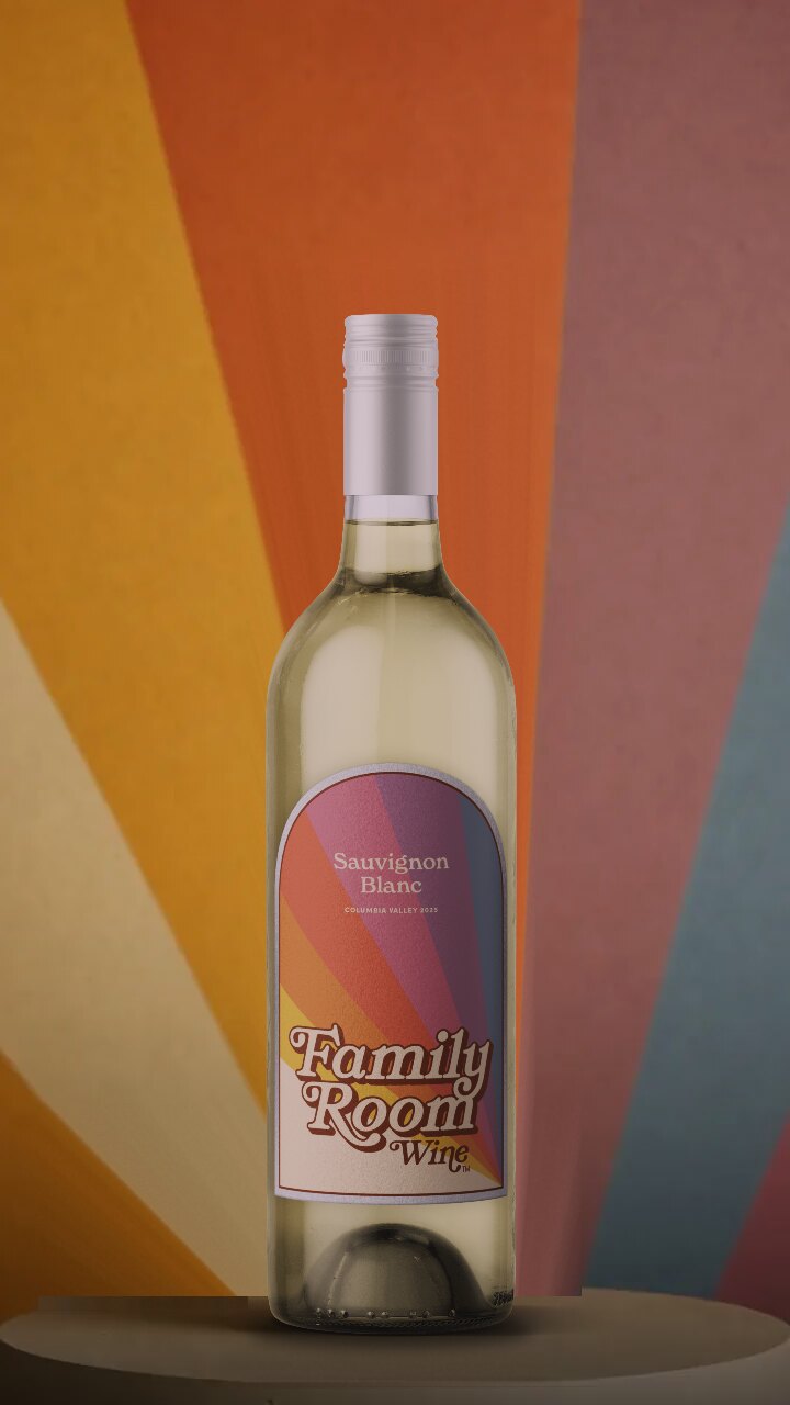 Bottle of Family Room 2025 Sauvignon Blanc against a rainbow sunburst wall