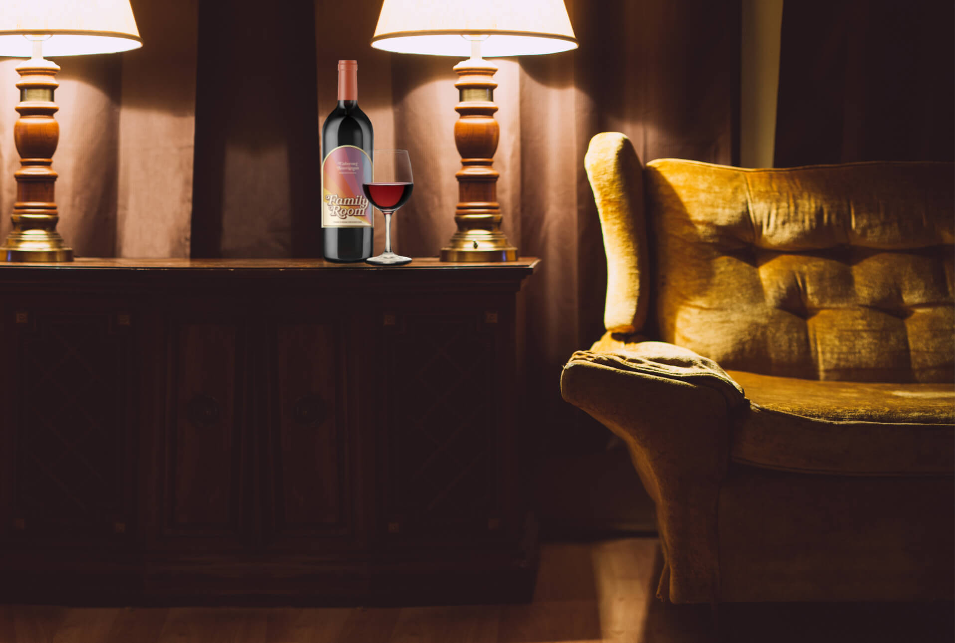 photo of Family Room wine bottle next to wine glass on a cabinet with lamps and a vintage style gold sofa